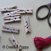 use miniature clothes pegs for hanging cross stitch  ornament