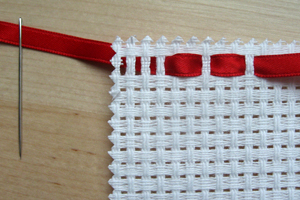 openwork threaded with a fine satin ribbon