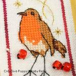 cross stitch patterns with  a lantern, a red robin, a snowman and stars. (zoom 2)